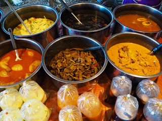 Selling Thai traditional food at a street market in Thailand