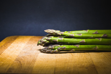 raw green asparagus on background