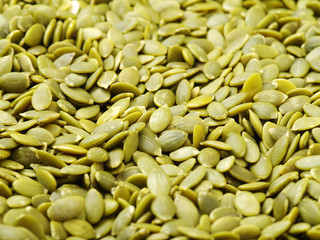 Macro background texture of green pumpkin seeds