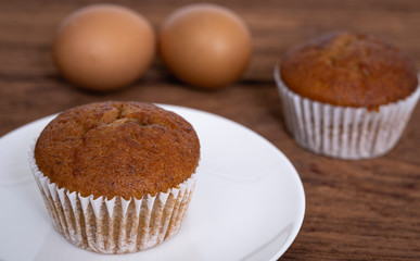 Banana cupcakes on  wood table