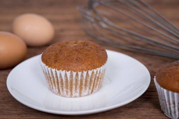 Banana cupcakes on  wood table