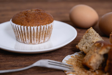 Banana cupcakes on  wood table