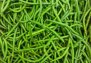 the green asparagus beans in a pod. fresh harvest of green beans in street market