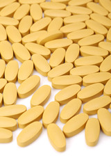 vitamin C tablets on white background