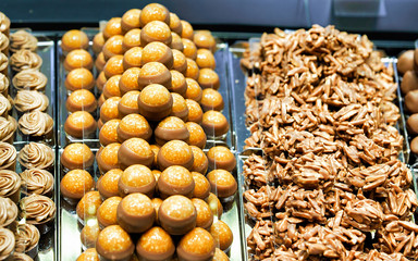 Selection of Swiss caramelized chocolate sweets with nuts reflex