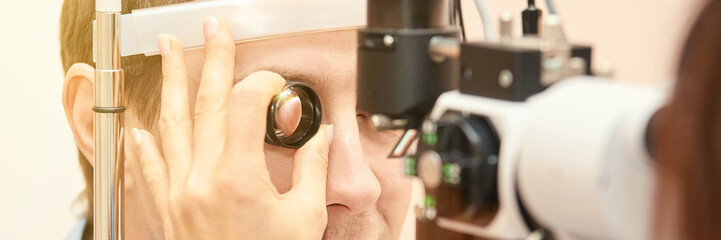 Eye doctor diagnostic. Patient at medical clinic. Cataract ophthalmology exam. Astigmatism...