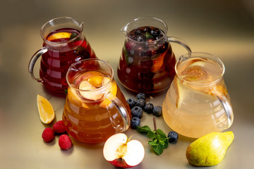 Several glass teapots with winter warming fruit drink 