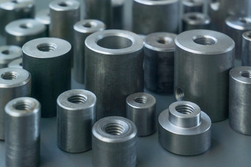 industrial background. cylindrical metal details on grey background