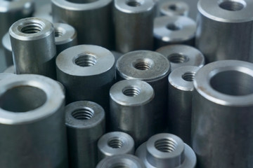 industrial background. cylindrical metal details on grey background