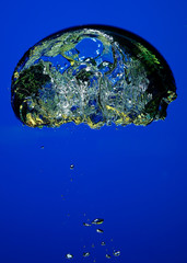 Study of very large bubble in water tank against blue