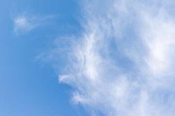Clear blue sky with white clouds.