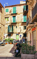 Obraz na płótnie Canvas Scooter at the street of Monreale town Sicily Europe reflex
