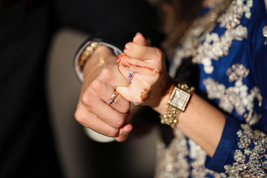 Wearing a ring at the engagement ceremony in india Stock Photo - Alamy