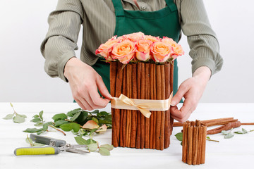 How to make floral arrangement with roses and cinnamon sticks