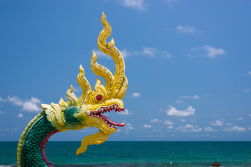 Dragon sculpture and sea background