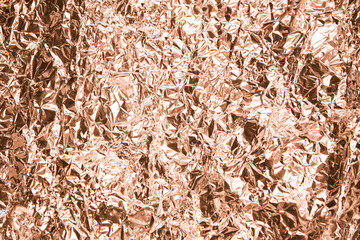 Foil aluminum crushed texture. Metal material background. Gold grunge decoration. Material pattern. Crinkle yellow chrome paper. Fabric shine sheet. Grey color. Copyspace for text