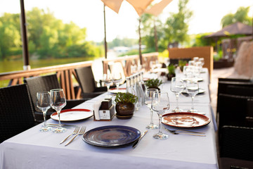 Fototapeta premium Stylish table setting in an open-air restaurant.
