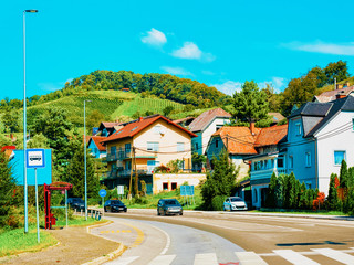 Pedestrian crossing and Residential houses along road in street Maribor reflex new