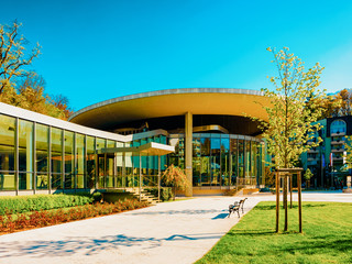 Entrance into Medical center building with flags of Rogaska Slatina reflex new
