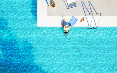 Recreation concept of blue waves water pool background with copy space. Top view from drone above...