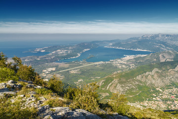 Fototapeta na wymiar Sunrise panoramic morning view of mountain randge and Kotor bay, Montenegro. View from the top of the mountain serpentine.