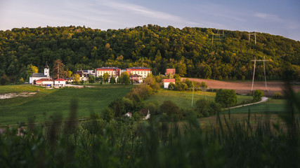Obraz premium Research facility and church on a hill in Petnica village near city of Valjevo in western Serbia