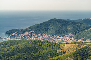 Fototapeta premium Sunny aerial panoramic view of old town of Budva and Riviera, Montenegro.