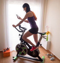 Young girl doing exercise at home.