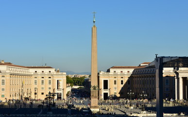Fototapeta na wymiar Vatican City, View of St. Peter’s Square with the egyptian Obelisk and blue sky at sunset. Rome, Italy.
