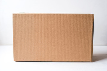Cardboard box on white background. Copy space for text.