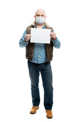 The masked man is holding an empty sheet of white paper. Precautions during the coronavirus pandemic. Isolated on a white background. Vertical. Full height.