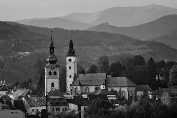 Middle-age castle Barbican and church of the Assumption of the Blessed Virgin Mary in Banska Bystrica, Slovakia. Town fortification. Historical monuments in modern city centre