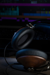 Hi-Fi headphones and computer in a home-studio audio recording and producing