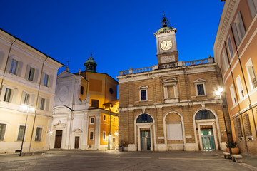 Fototapeta na wymiar Ravenna - The square Piazza del Popolo, and church Chiesa di Santa Maria del Suffragio at dusk.