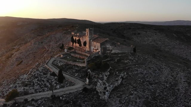 Aerial anti-clockwise pan close up of a monastery on top of a hill in Bocairent, Valencia, Spain