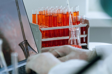 close up. scientist works on a laptop in a modern laboratory.