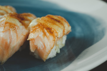 Burn salmon sushi. Selective focus