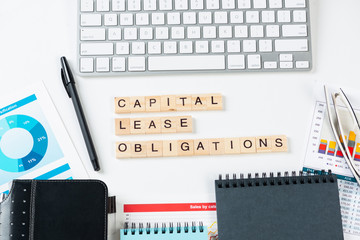 Capital lease obligations concept with letters