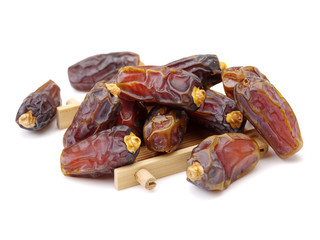 Delicious fresh organic dates on white background