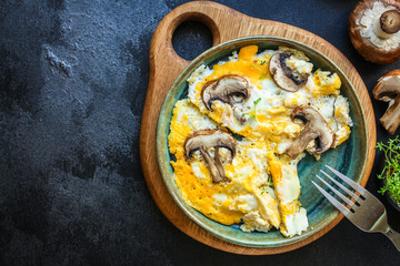 scramble fried eggs
omelet mushrooms
Menu concept healthy eating. food background top view copy space for text
keto or paleo