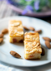 Almond slices with whole almonds on a plate
