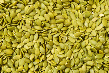 Macro background texture of green pumpkin seeds