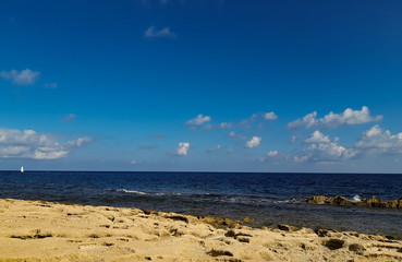 Fototapeta na wymiar Sea view with blue sky from rocks in Valetta, Malta