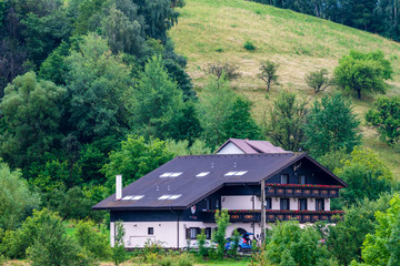 Fototapeta na wymiar Modern houses on the hills from Bran, Brasov, Romania