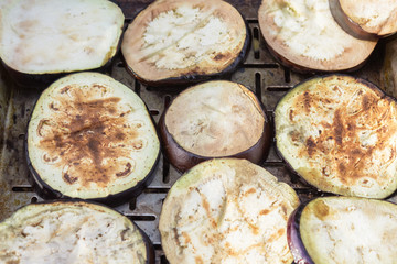 delicious eggplant is sliced and fried on the grill. Vegetarian cuisine and healthy food after the end of quarantine