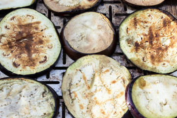 delicious eggplant is sliced and fried on the grill. Vegetarian cuisine and healthy food after the end of quarantine