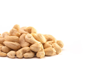 A Pile of Raw Natural Cashew Nuts Isolated on a White Background