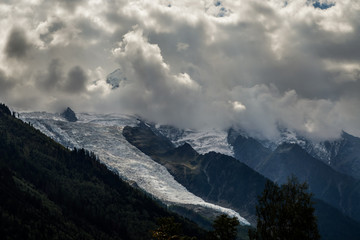 Glacier des Bossons viewed from Chamonix in a cloudy day of september. Mont Blanc Massif, French Alps, Chamonix, Bosson Glacier, France, Europe.