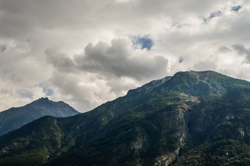 Italian Alps mountains in a cloudy september day, seen from Courmayeur area, Aosta Valley, Italy.