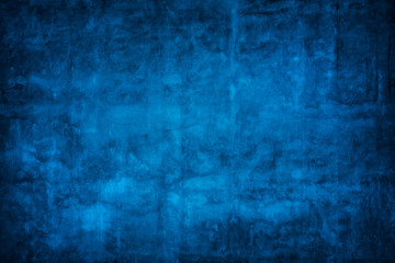 Fototapeta na wymiar Blue wall background with darker black grungy border and vintage texture design.